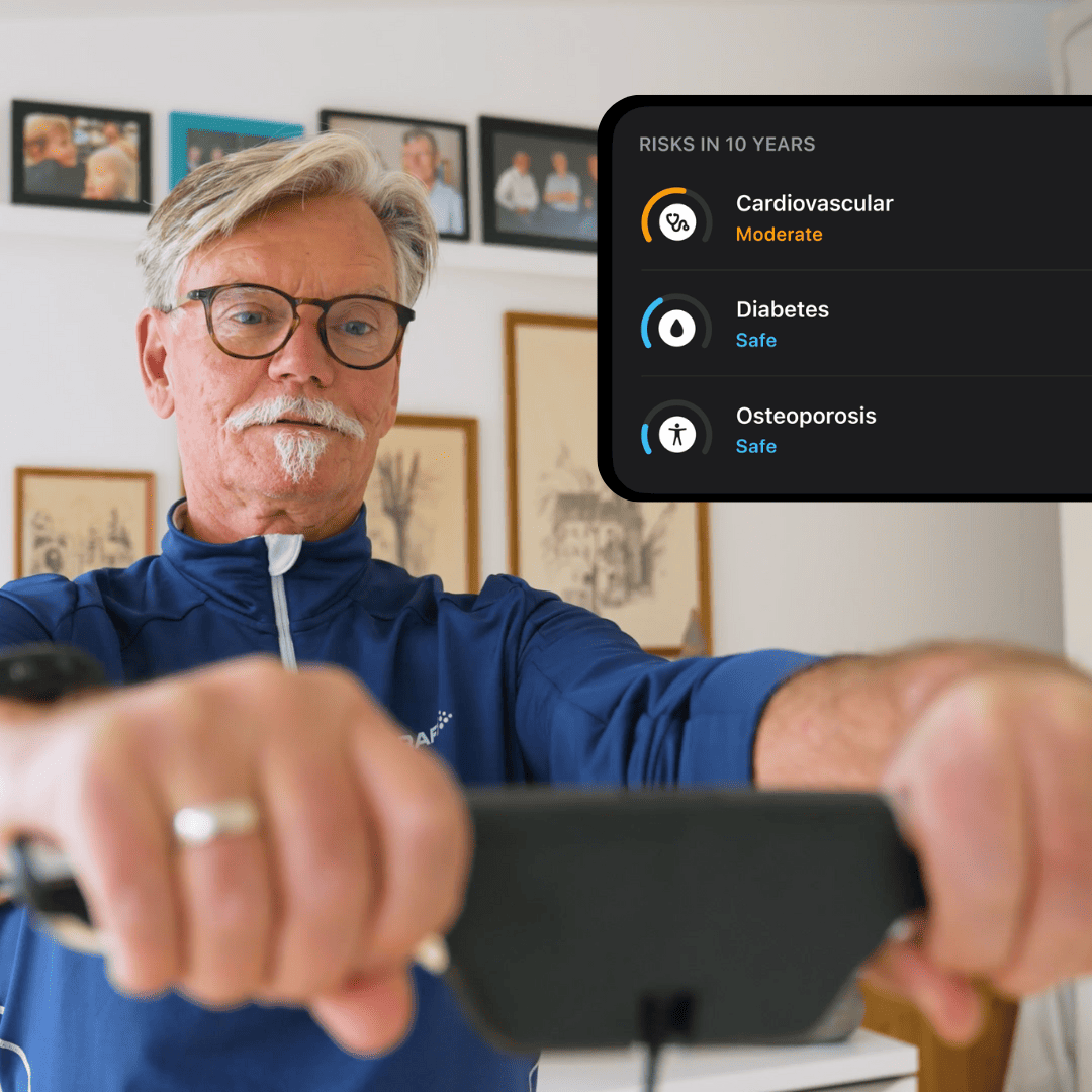 Man holding a device with health risk assessment overlay on screen.