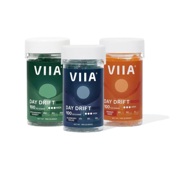 Three jars of VIIA Day Drift gummies in green, blue, and orange packaging.