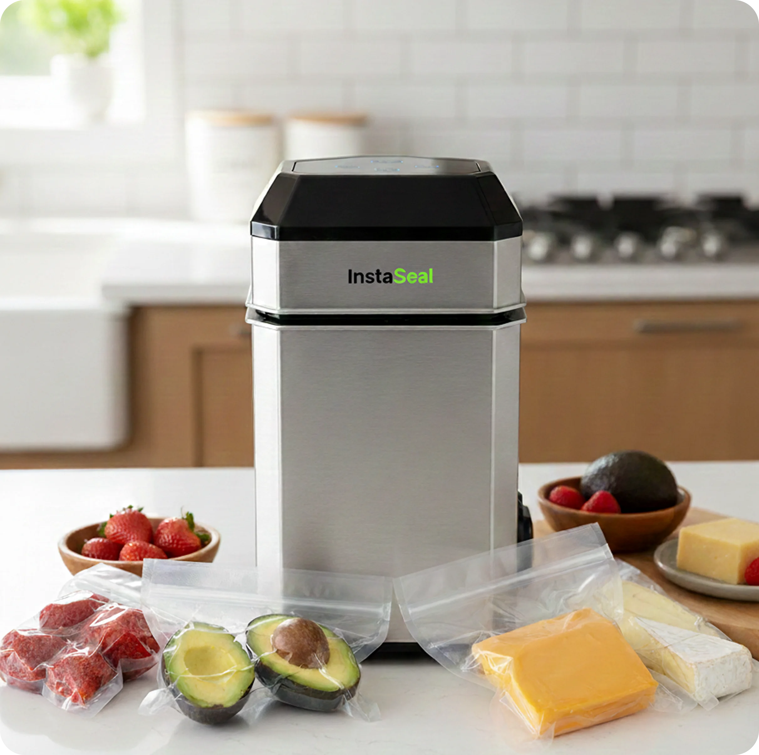 An InstaSeal vacuum sealer on a kitchen counter, surrounded by vacuum-sealed bags of fruit and cheese.