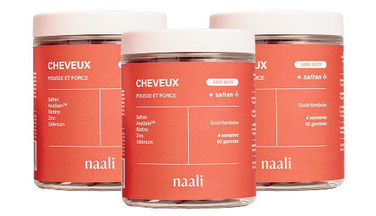 Three jars of Naali hair growth supplements with saffron.