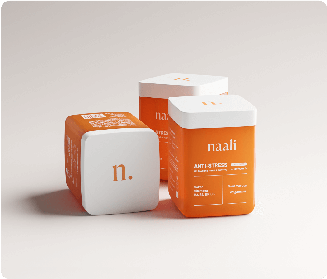 Three orange and white containers labeled 'naali' and 'ANTI-STRESS'.