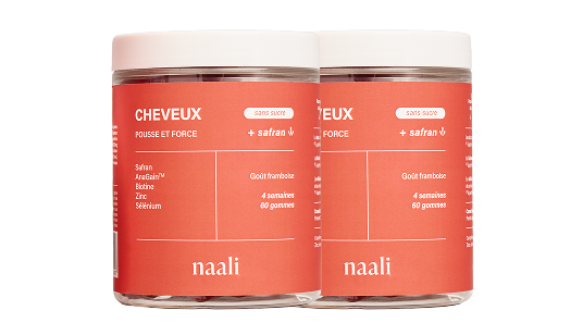Two jars of Naali hair growth gummies with saffron and raspberry flavor.