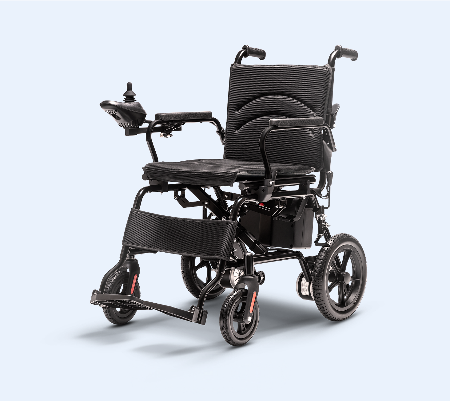 Black electric wheelchair with joystick control on a light background.