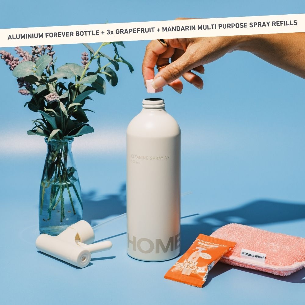 Assorted toilet paper rolls with packaging and a box on a blue background.