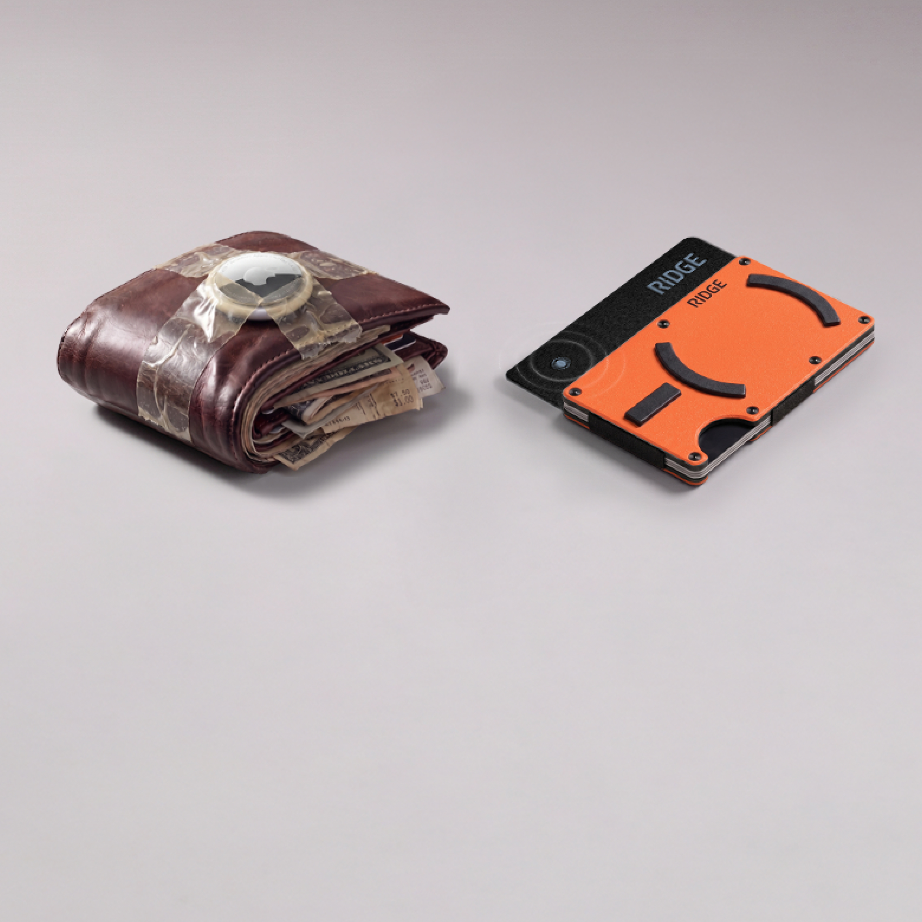 A bulky, overstuffed old wallet sits next to a slim, modern orange and black Ridge wallet.
