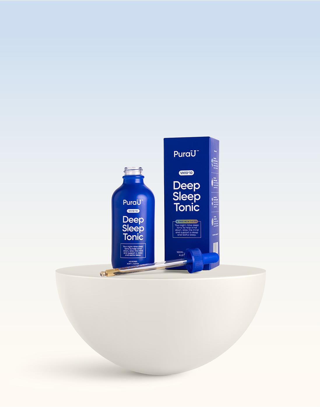 Blue bottle and box labeled 'Deep Sleep Tonic' on a white bowl.