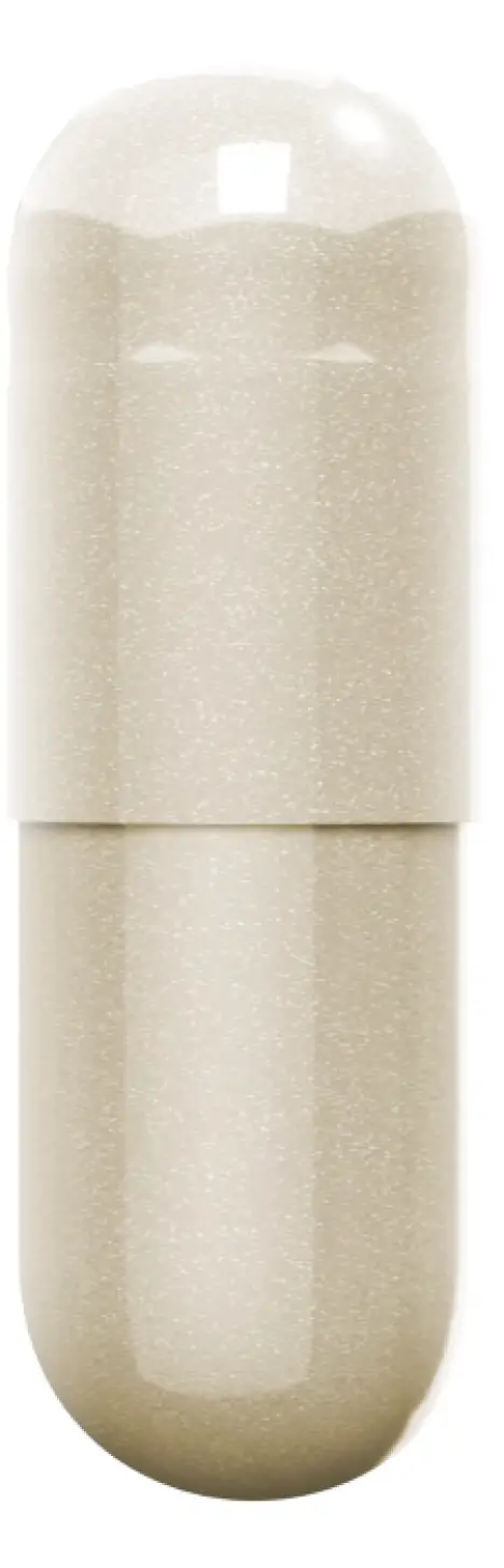 A beige capsule with a glossy surface.