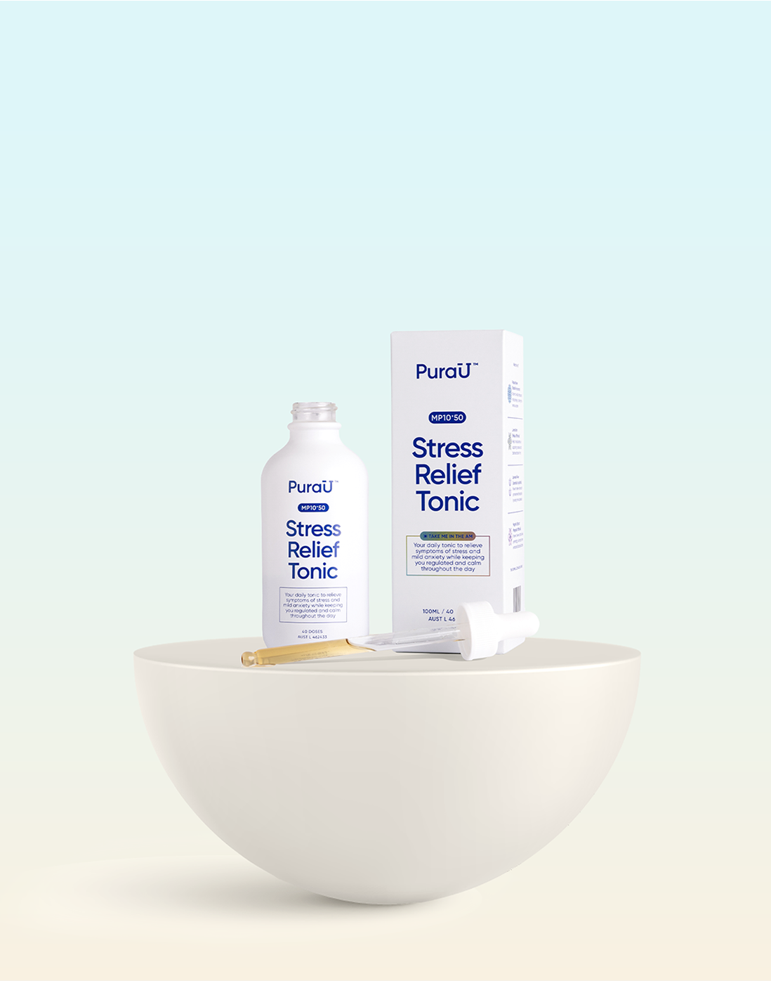 Bottle and box of PuraU Stress Relief Tonic with a dropper on a round surface.