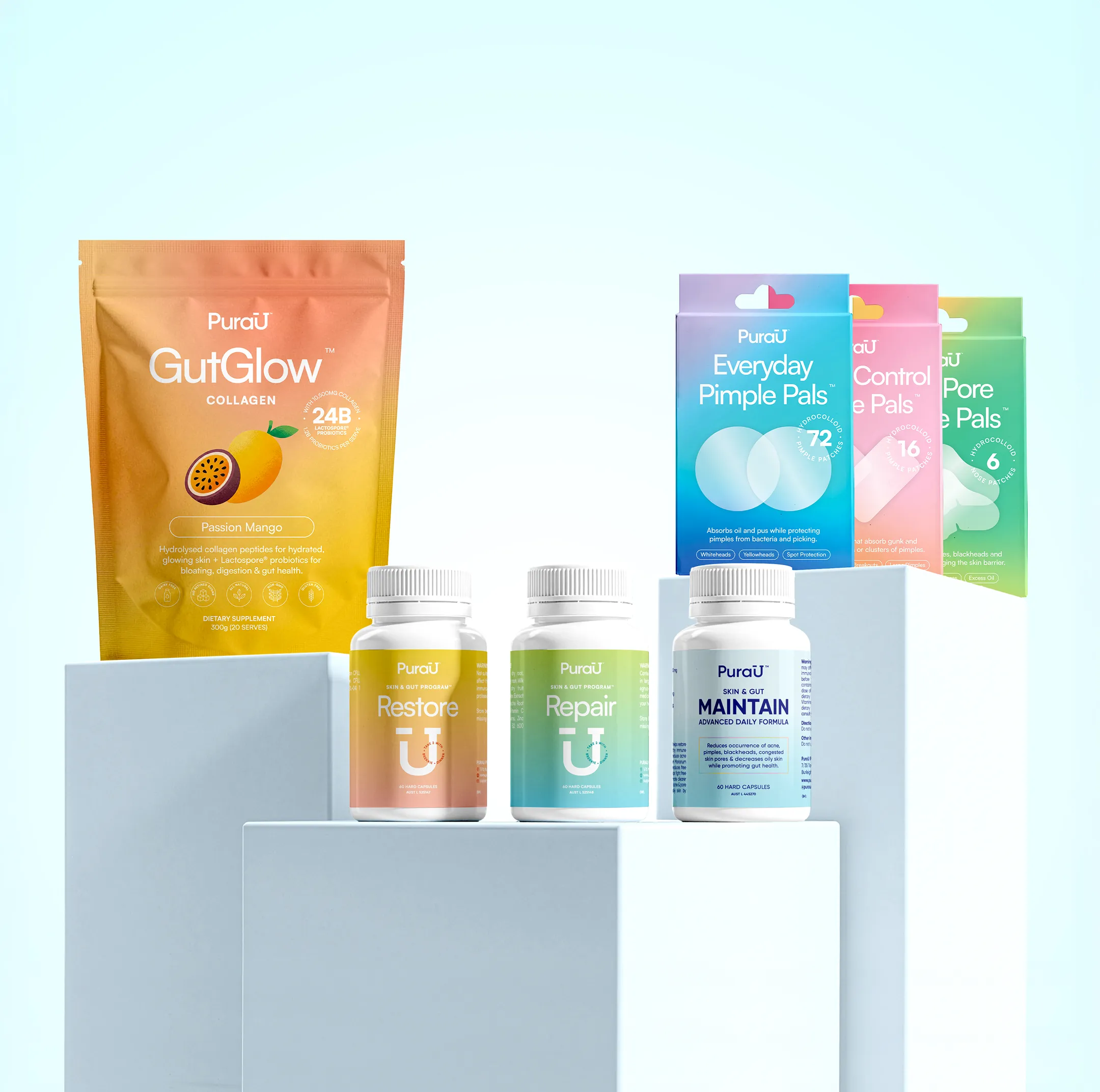 A collection of PuraU brand supplements and skincare products arranged on white blocks against a blue background.