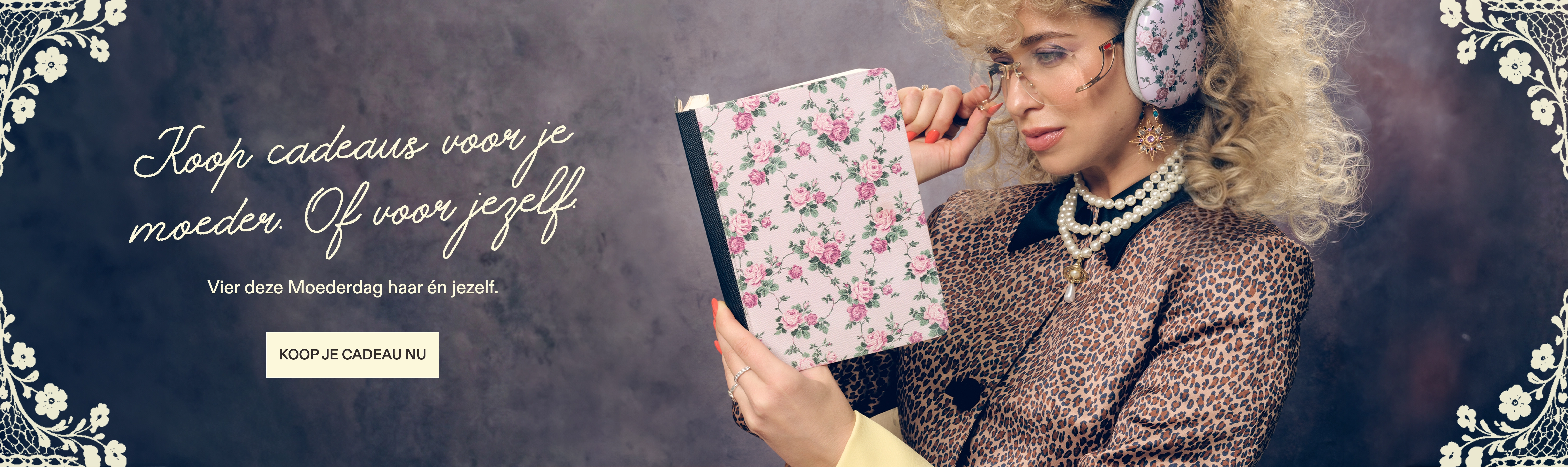 A woman with blonde curly hair in a leopard-print jacket holds a floral patterned book.
