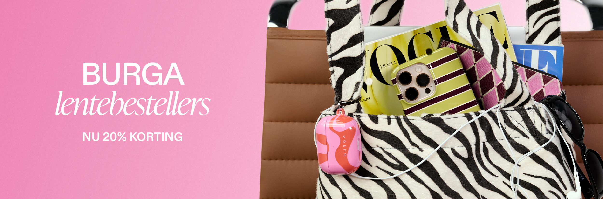 A zebra print bag filled with magazines, a phone in a striped case, and other colorful accessories.