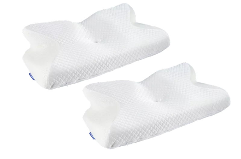 Two white ergonomic pillows with a textured surface.