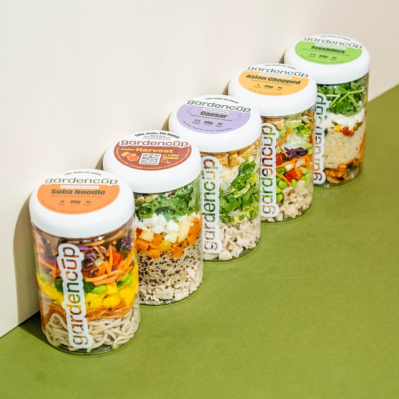 A row of five different Gardencup layered salads
