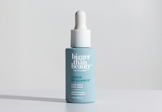 Close-up of Bigger Than Beauty Liquid Brilliance Super Serum bottle label