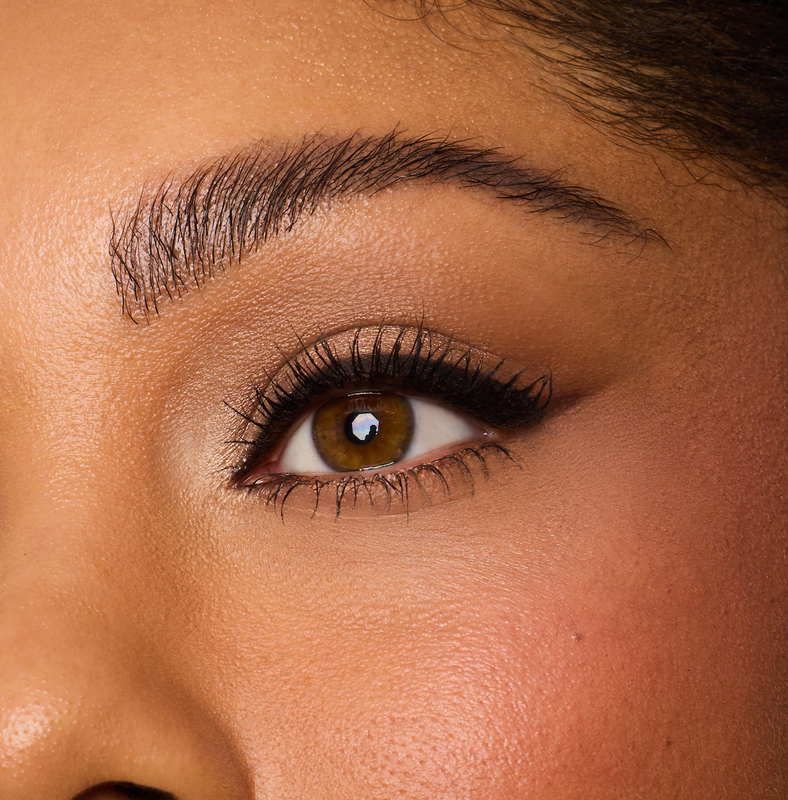 Close-up of a person's eye with detailed makeup and eyelashes.