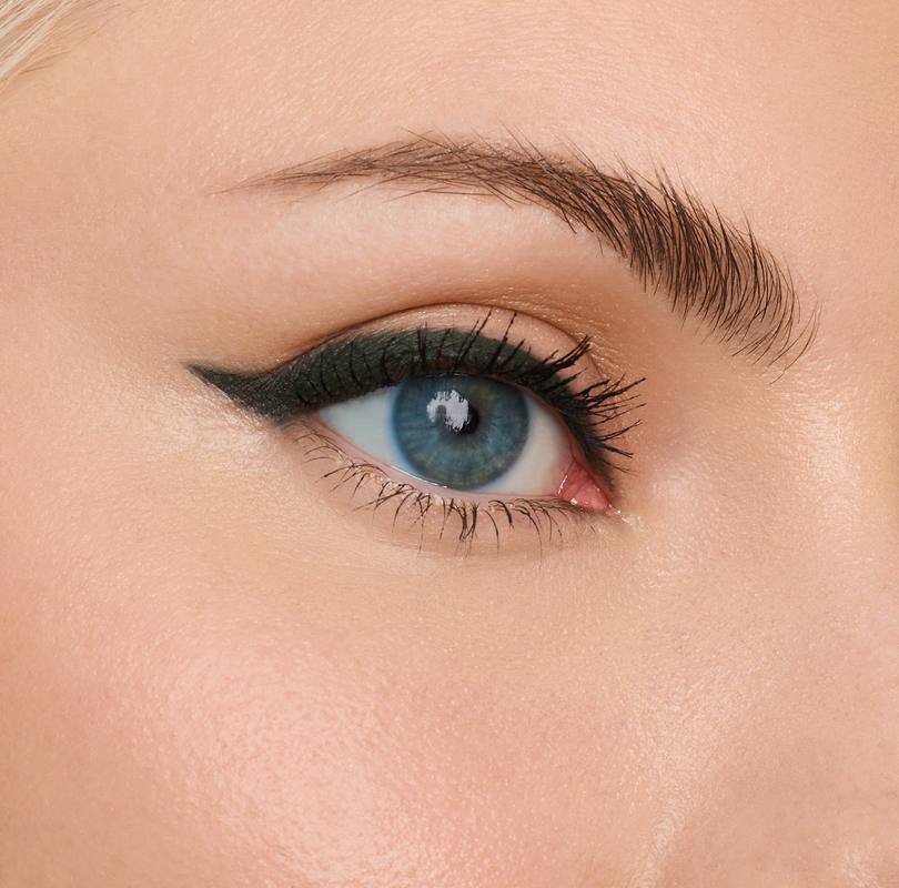 Close-up of a blue eye with winged eyeliner and mascara.