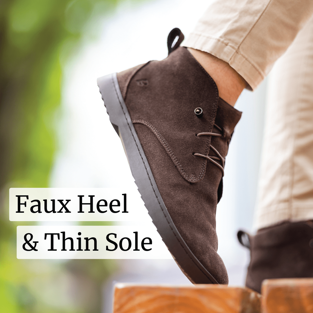 Close-up of a brown suede shoe with faux heel and thin sole.