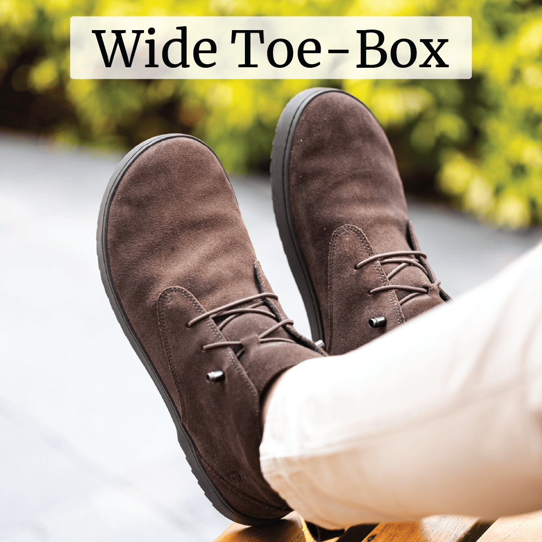 Brown shoes with wide toe-box, worn by a person in light pants.