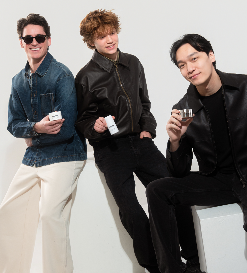 Three men pose with Forte brand grooming products against a plain white background.