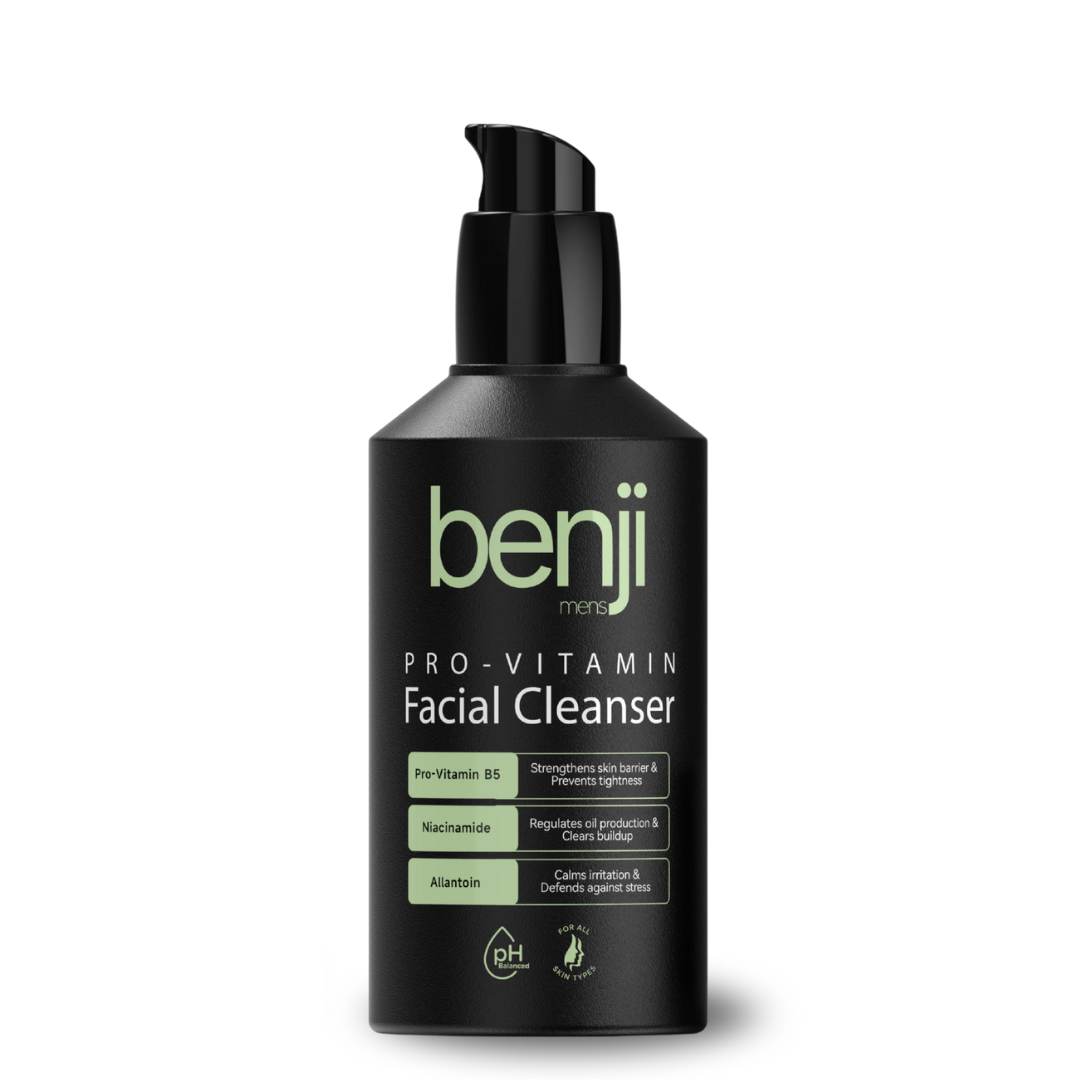 Black bottle of men's facial cleanser with green labeling.
