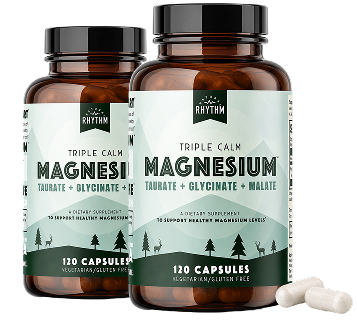 Two bottles of Rhythm Triple Calm Magnesium supplement with a few white capsules on a white background.