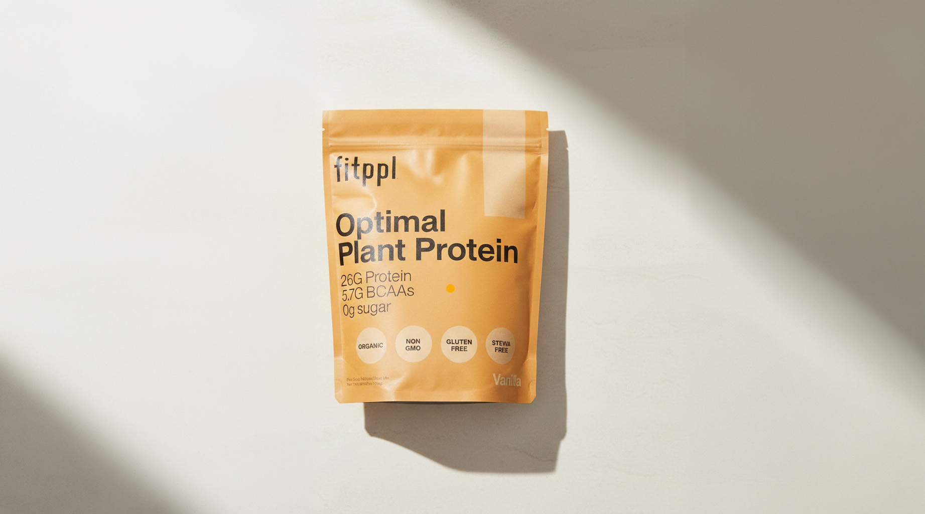 A pouch of fitppl Optimal Plant Protein in vanilla flavor, on a white surface with a shadow.