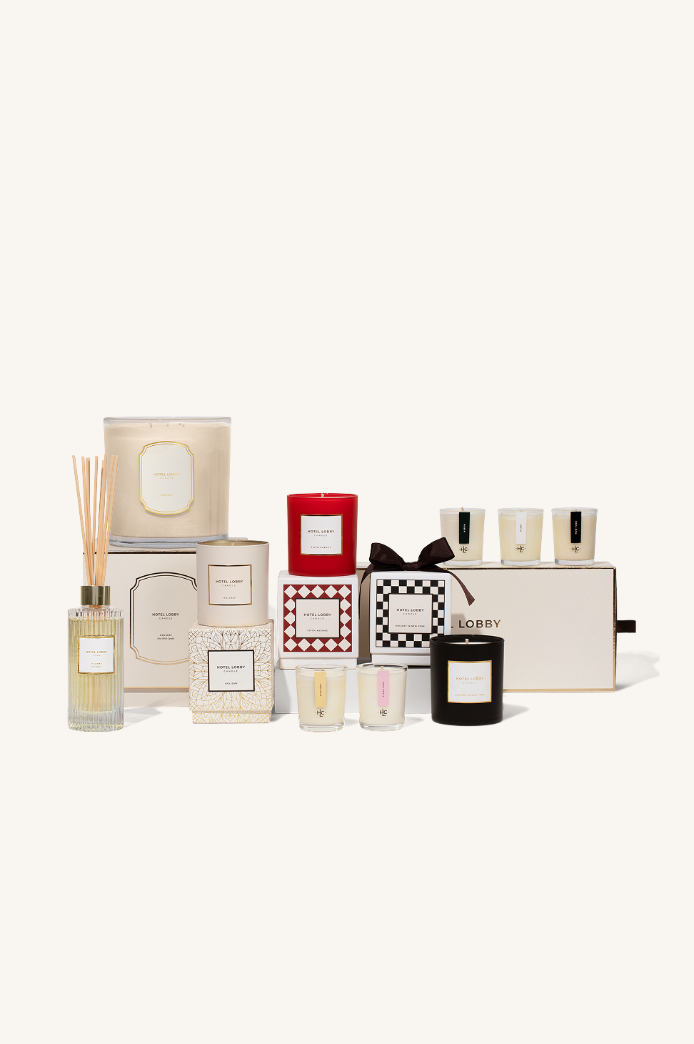 Assorted luxury candles and reed diffusers with packaging on display.