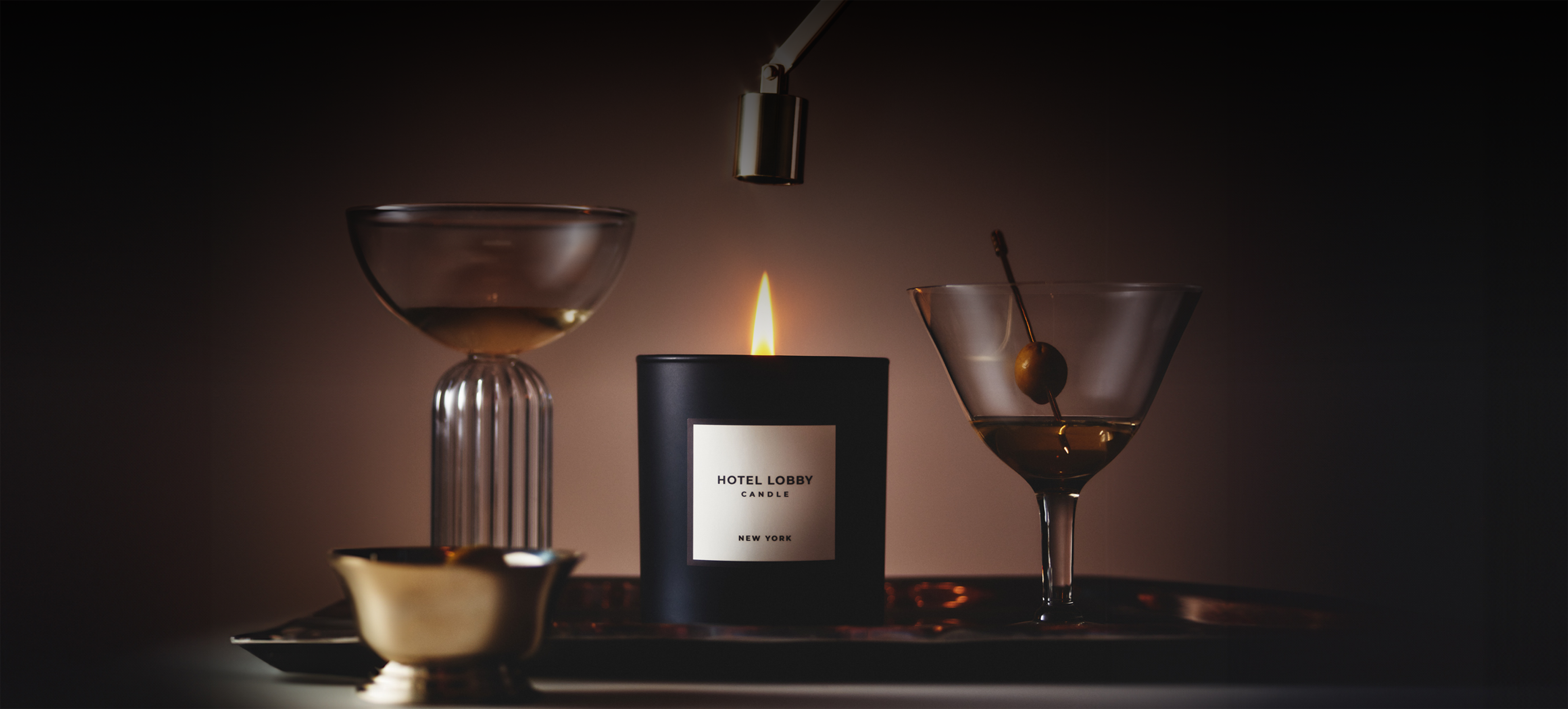 Lit candle labeled 'Hotel Lobby' with drinks and a lamp.