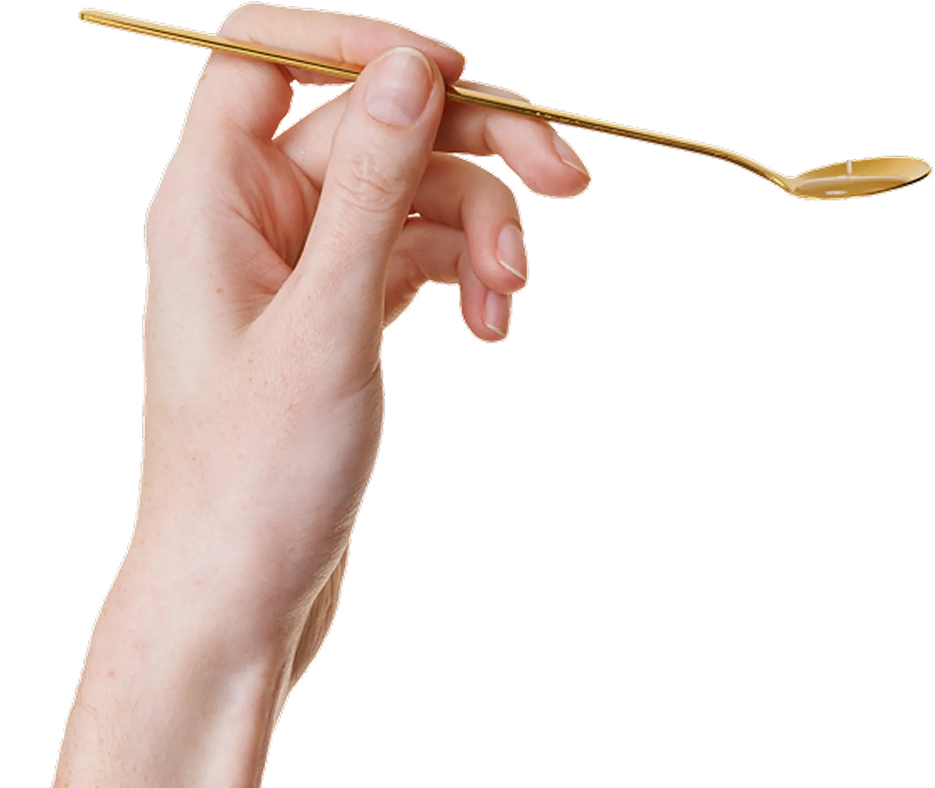 A hand holding a small, long-handled golden spoon against a solid green background.