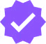 A purple, starburst-shaped badge with a white checkmark in the center.
