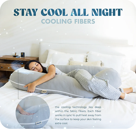 Person on large grey pillow in bed with text about cooling fibers.