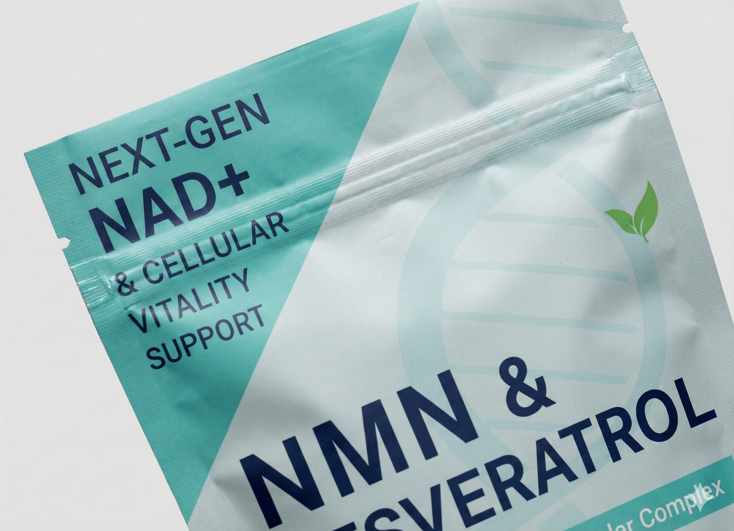 A close-up of a white and turquoise supplement pouch labeled 'Next-Gen NAD+' and 'NMN & Resveratrol'.