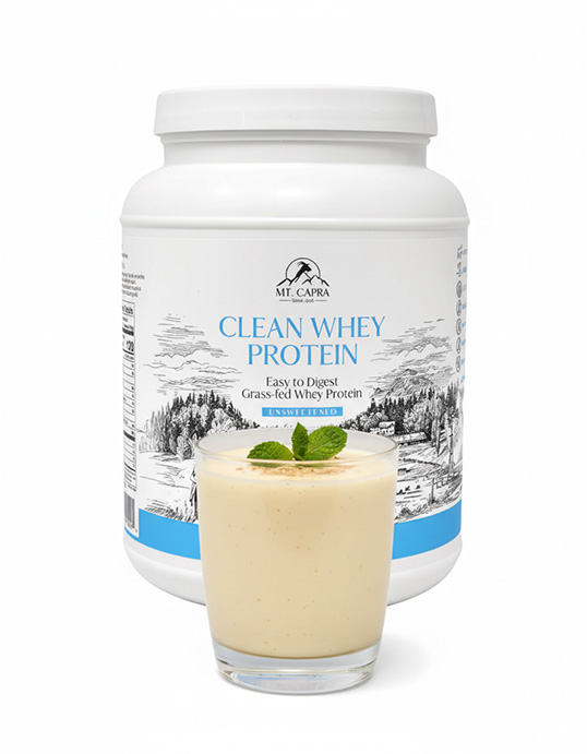 A container of clean whey protein with a glass of smoothie in front.
