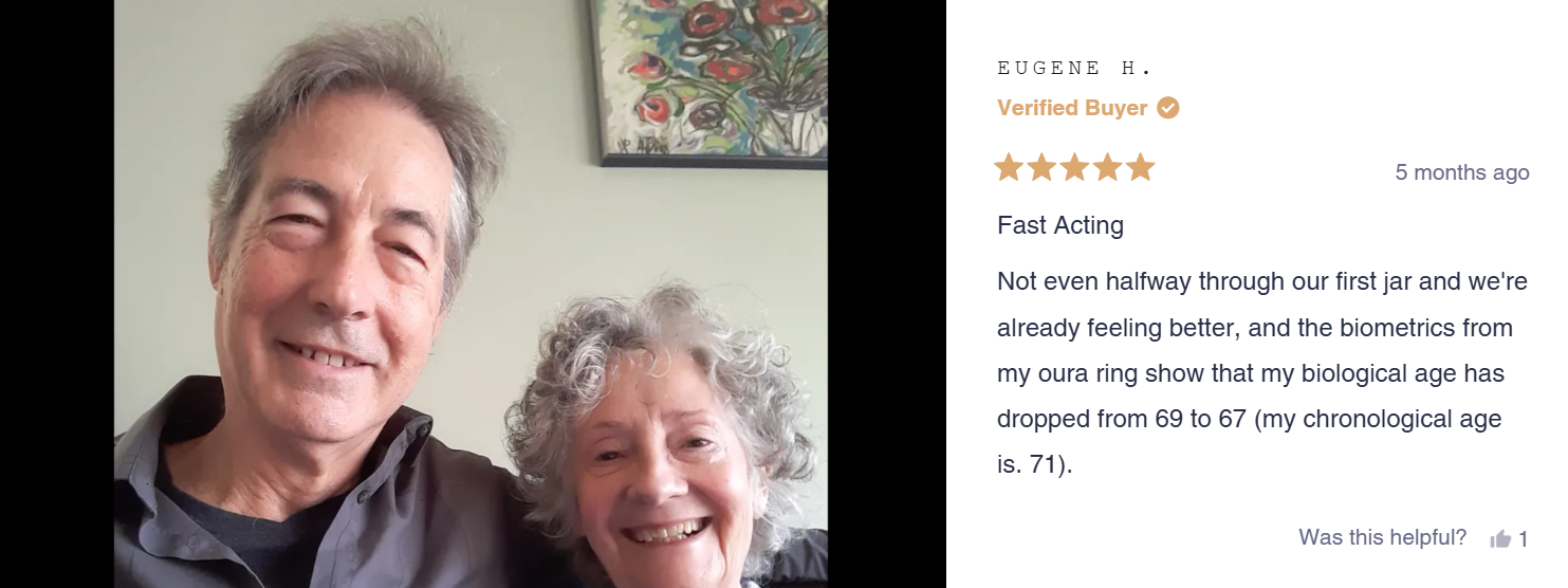 Smiling older couple posing for a selfie indoors.