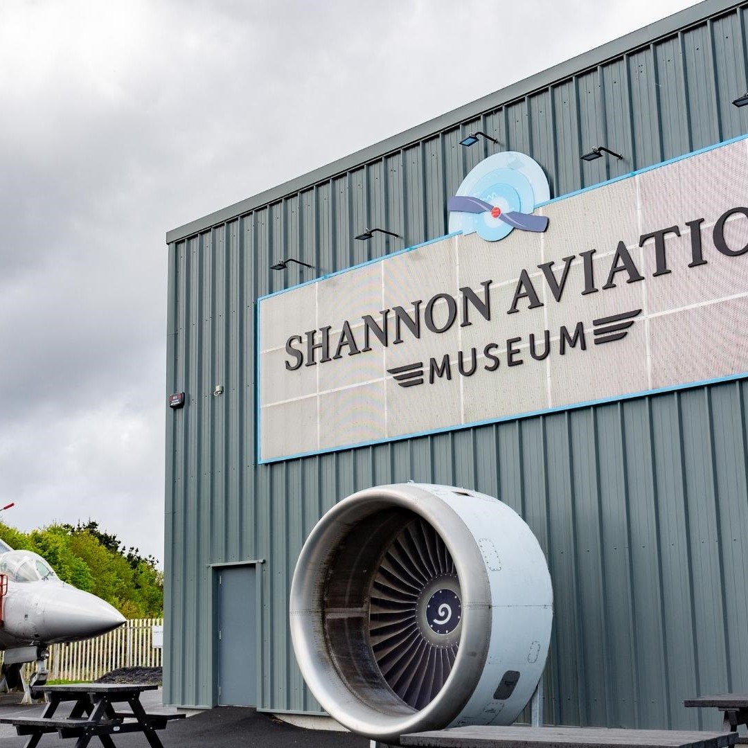 Exterior of Shannon Aviation Museum with aircraft engine display.