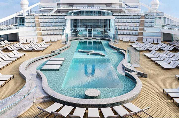 Luxurious cruise ship deck with a central pool and numerous sun loungers.