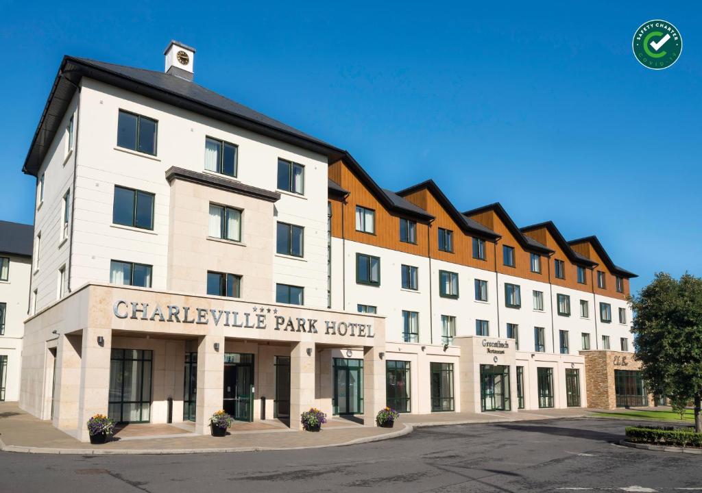 Exterior view of Charleville Park Hotel with clear blue sky.