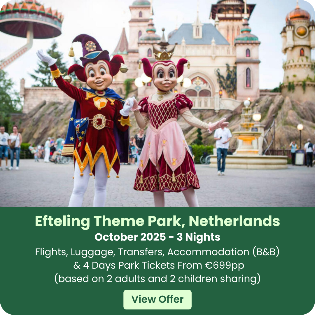 Two costumed characters in a theme park with a castle backdrop.