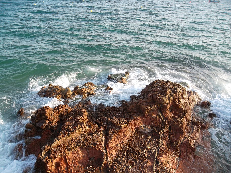 Rocky coastline with waves crashing against the shore.