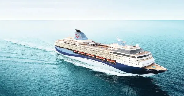 A large cruise ship sailing on a calm ocean.