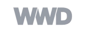 'Logo of WWD in bold, gray letters on a transparent background.'