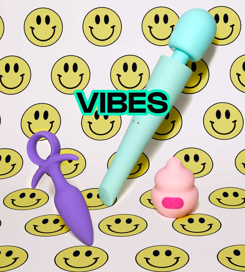 Three colorful sex toys arranged on a background patterned with yellow smiley faces, with the word 'VIBES'.