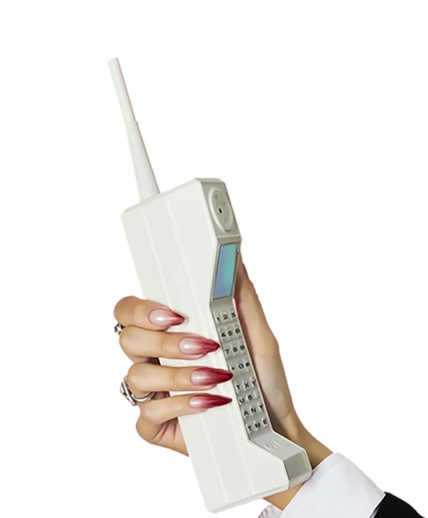A hand with long, red ombré nails holds a large, white, vintage mobile phone against a white background.