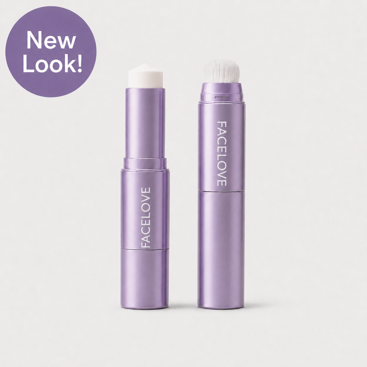 Two white and silver FACELOVED makeup sticks, one with a brush, over a swatch of foundation.