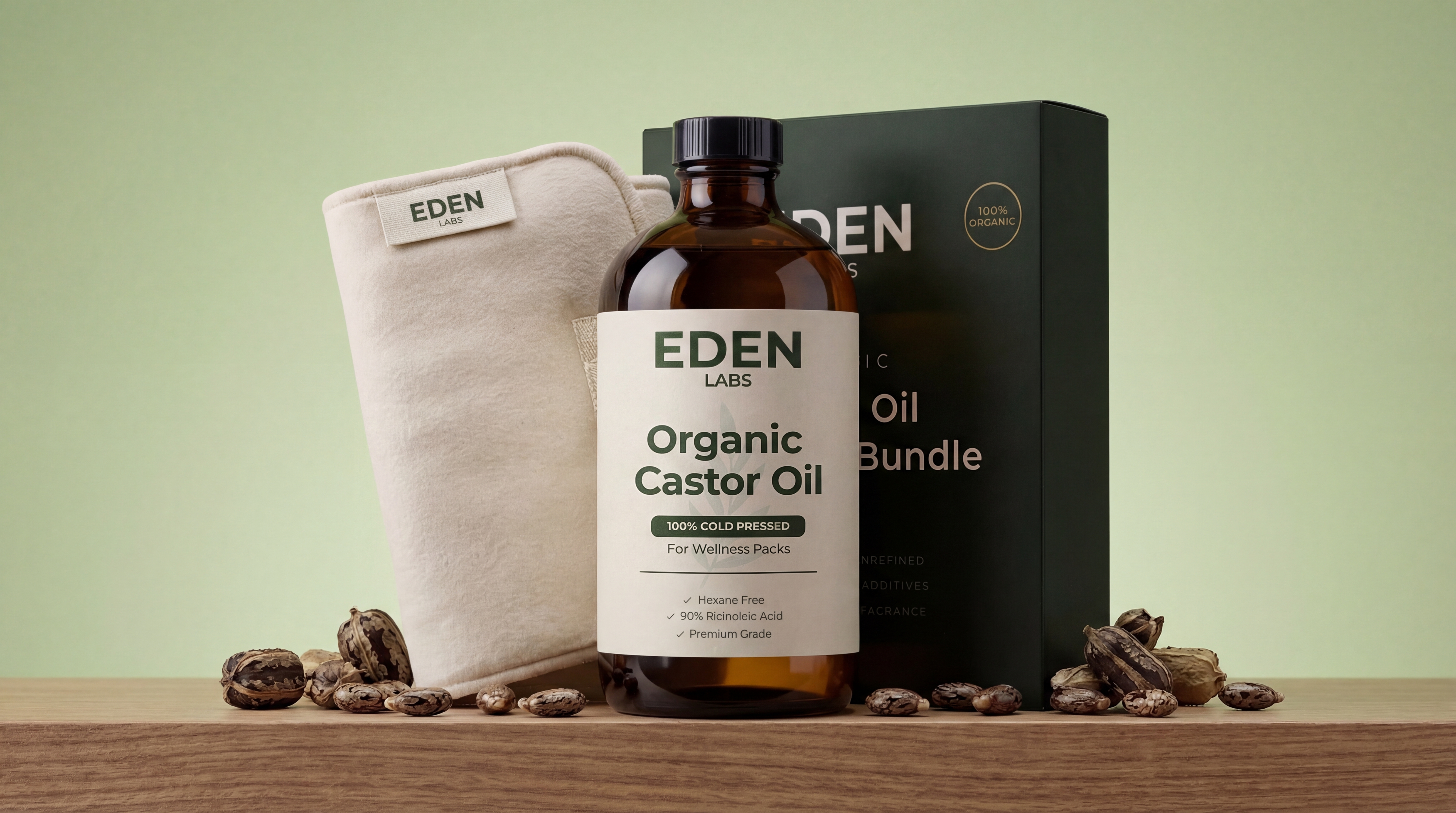 A bottle of Eden Labs Organic Castor Oil with its box, a cloth pack, and castor beans.
