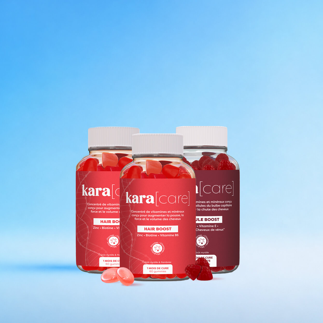 Three bottles of Kara Care Hair Boost gummy vitamins with raspberries against a gradient blue background.