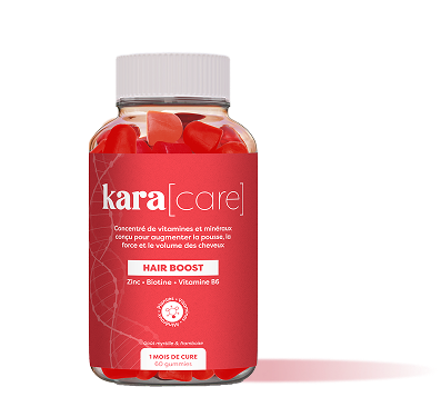 A bottle of Kara[care] Hair Boost, filled with red heart-shaped gummies, on a white background.