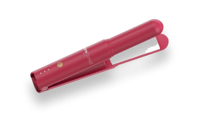A closed, cordless, pink hair straightener shown at an angle against a white background.