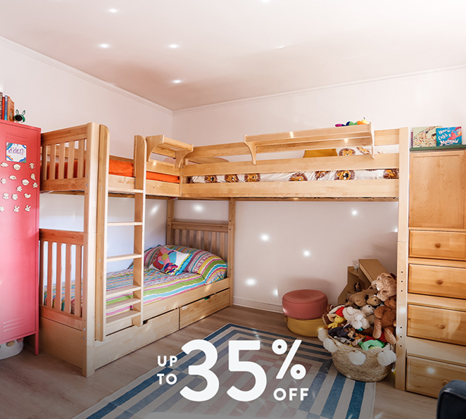 Wooden kids bunk bed with ladder, trundle storage and colorful bedding in children's bedroom with toys, rug and 'Up to 35% off' sale overlay.