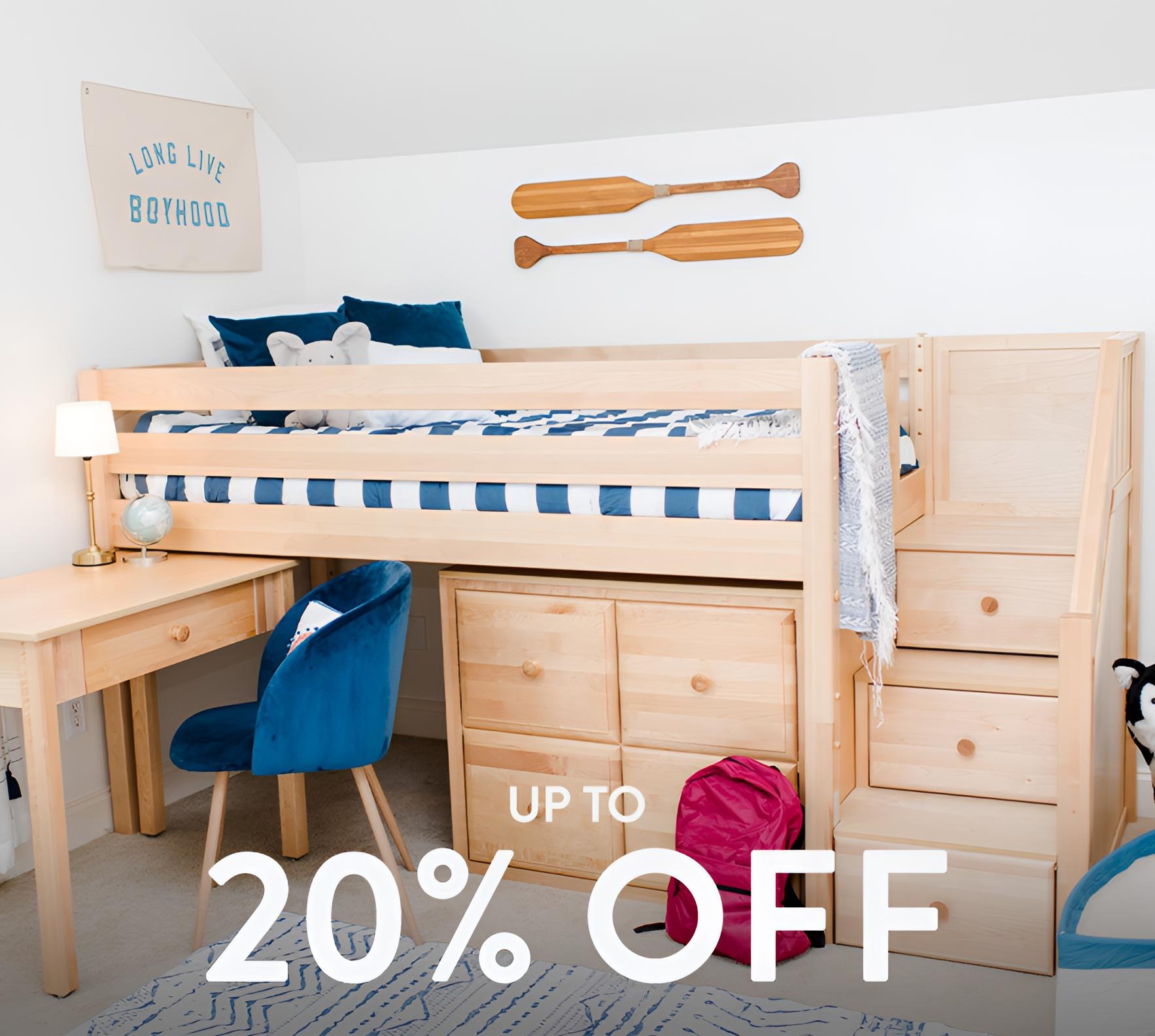 Natural wood kids loft bed with built-in desk, stair drawers and under-bed storage, navy striped bedding and chair — up to 20% off.